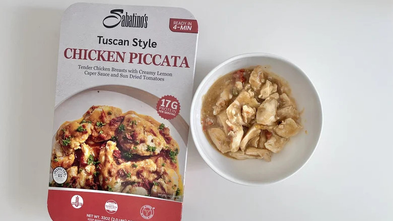 A package of Sabatino's Tuscan Style Chicken Piccata beside a bowl of the product