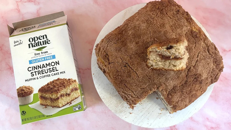 Open Nature's gluten free coffee cake on a serving dish with a slice