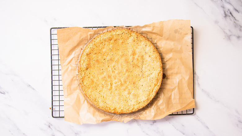 Cake cooling on parchment.