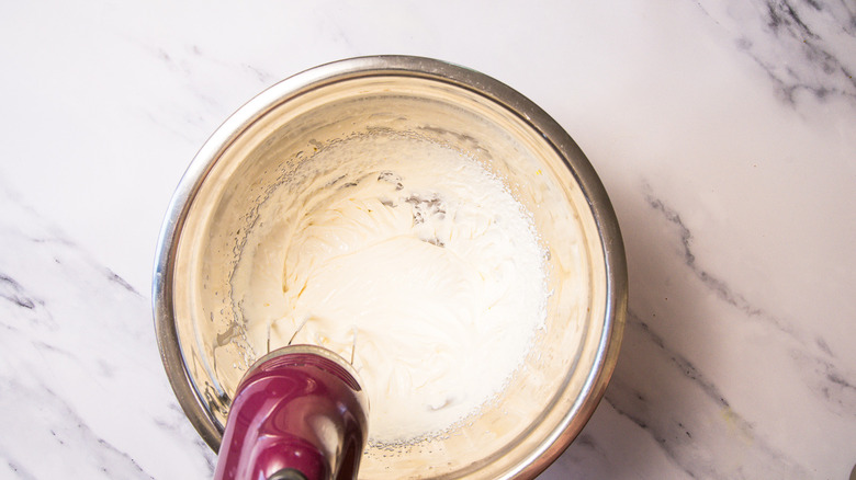 Whipping mascarpone cream.