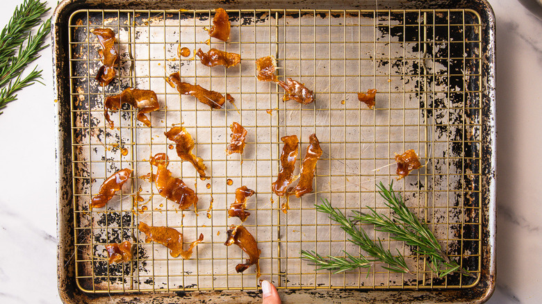 Candied lemon strips on baking sheet.