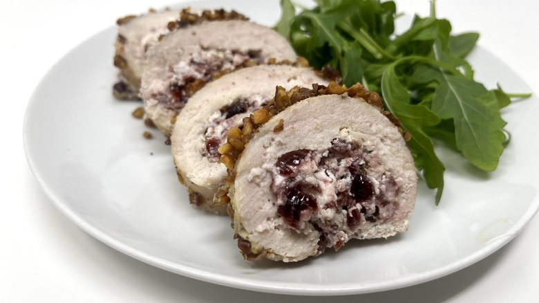 Walnut-crusted cranberry chicken roulade