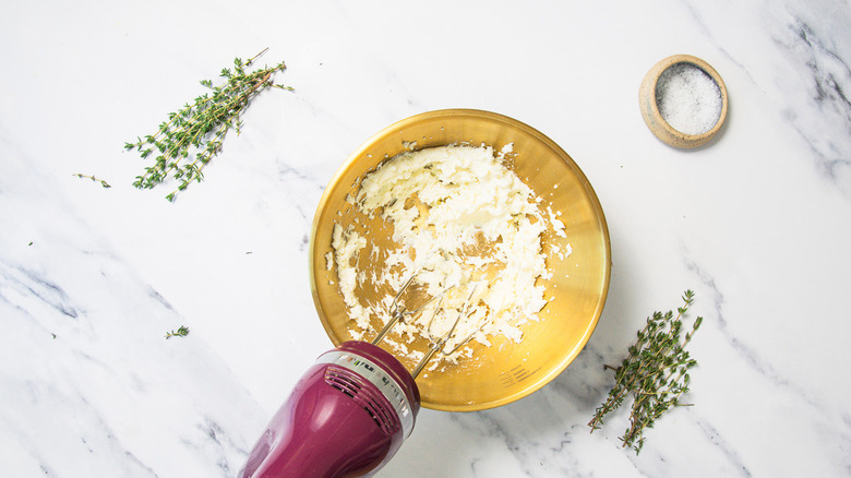 Blending honey with goat cheese.