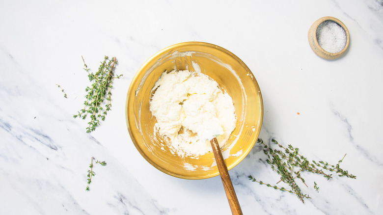 Combining whipped cream with goat cheese.