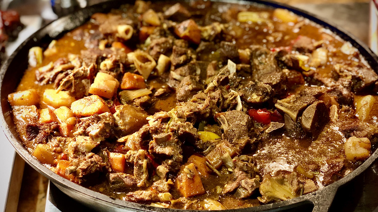 goat water stew in a pan