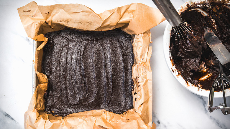 Bottom brownie layer in pan.