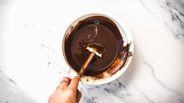 Stirring chocolate in bowl.