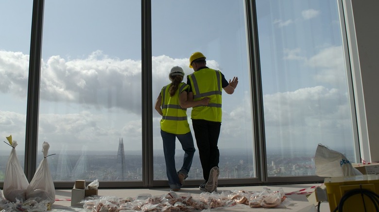 Chef Gordon Ramsay and his wife overlooking the view from 22 Bishopsgate in London