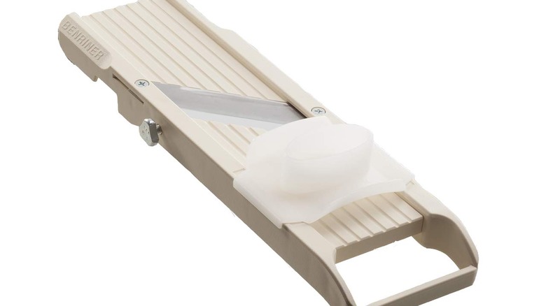 a Benriner #64 mandonline slicer, shown in the ivory color option on a white ground