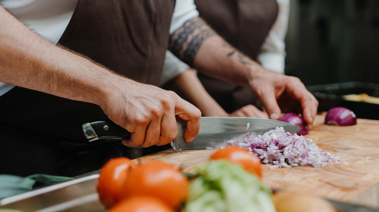 Chef chopping onions