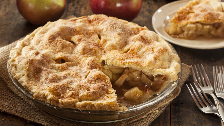 home made apple pie with slice removed