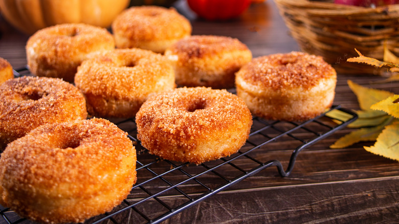 A rack of golden apple cider donuts
