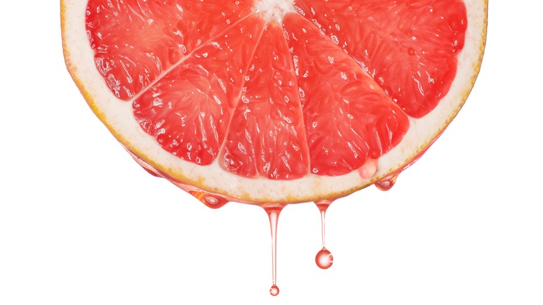 fresh grapefruit dripping juice