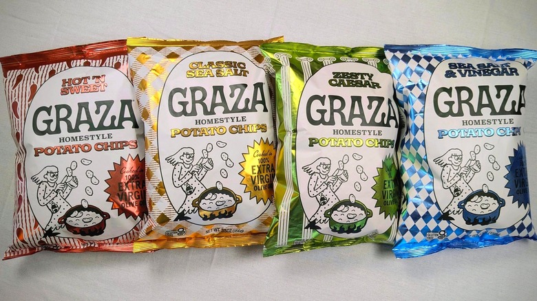 Four bags of Graza Homestyle Potato Chips in red, yellow, green, and blue on a white tablecloth