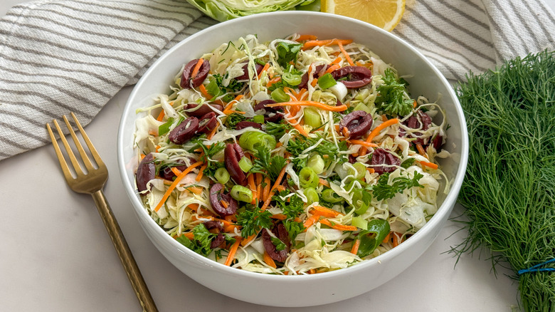 Greek cabbage salad lahano salata in white bowl