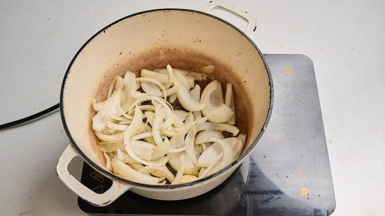 cooking onion and garlic in a pot