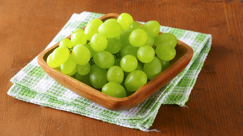 Green grapes in wooden container