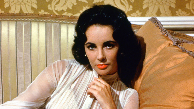 Elizabeth Taylor reclining on cushions