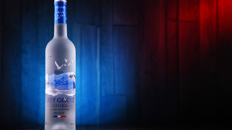 artist Kehlani poses with Grey Goose bottle at a New York Fashion Week party