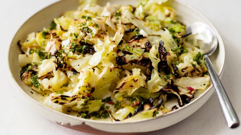 cooked cabbage in white bowl