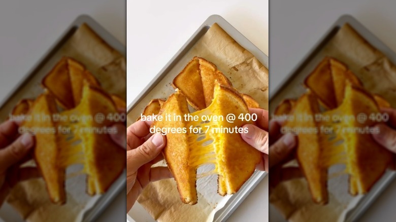 Pulling apart an oven-baked grilled cheese sandwich