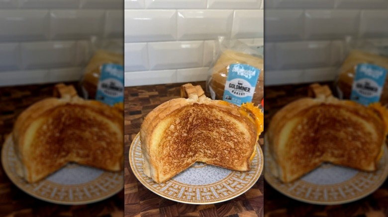 Grilled cheese sandwich made with three slices of bread