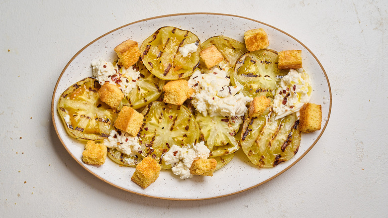croutons on a platter with tomatoes and cheese