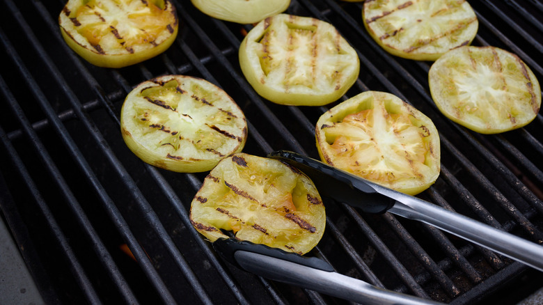 grilling tomatoes on a grill