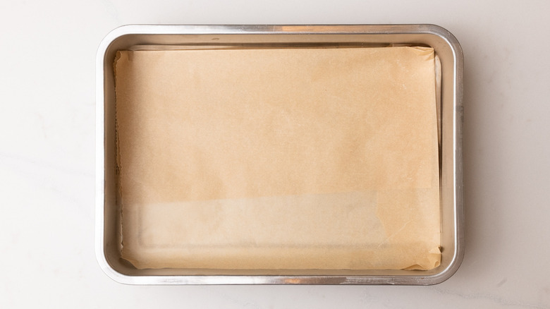 aerial view of baking tray lined with parchment paper
