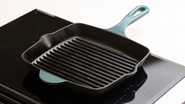 an empty griddle pan heating on hob