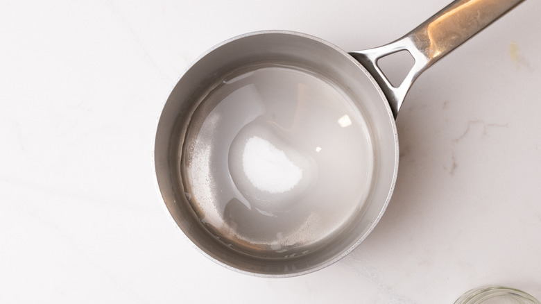 aerial view of sugar and water in a saucepan