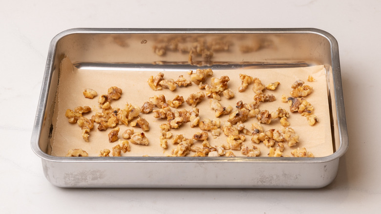 candied walnuts hardening on lined baking tray