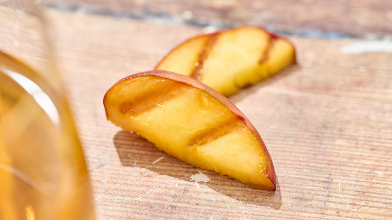 grilled peach slices on a table