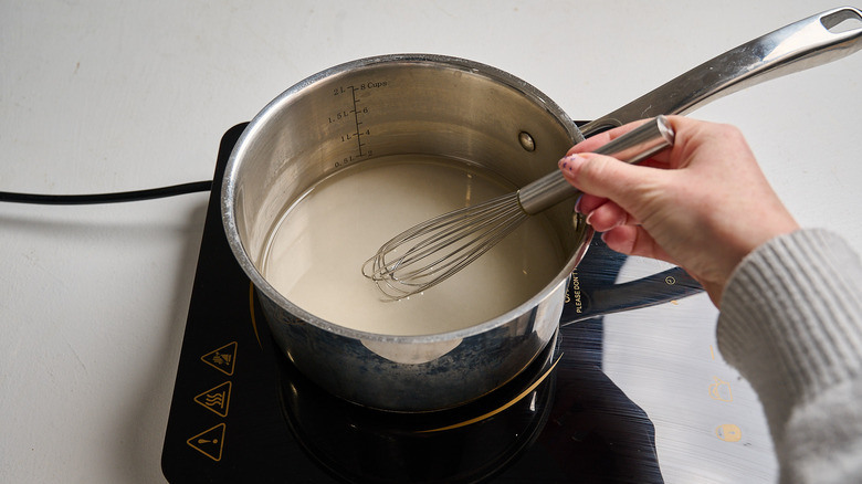 dissolving sugar in water in a saucepan