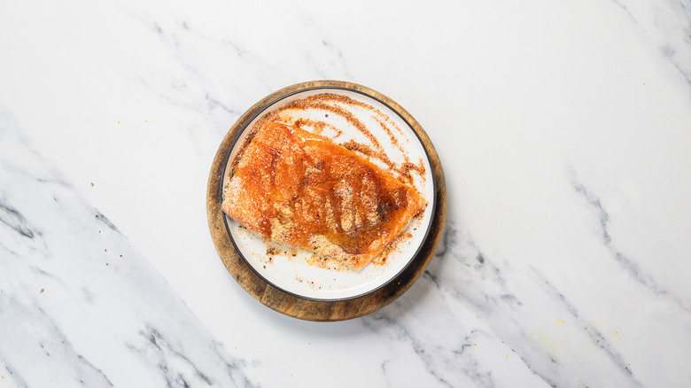 Seasoned fish on plate