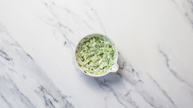 Green celery and herb slaw in small bowl
