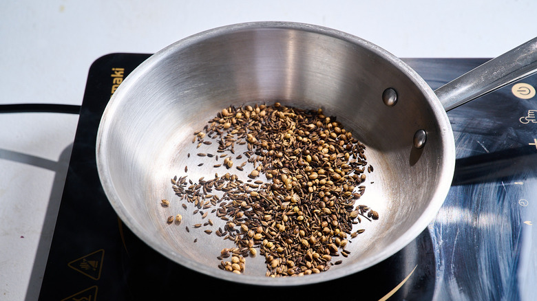 toasting spices in a skillet