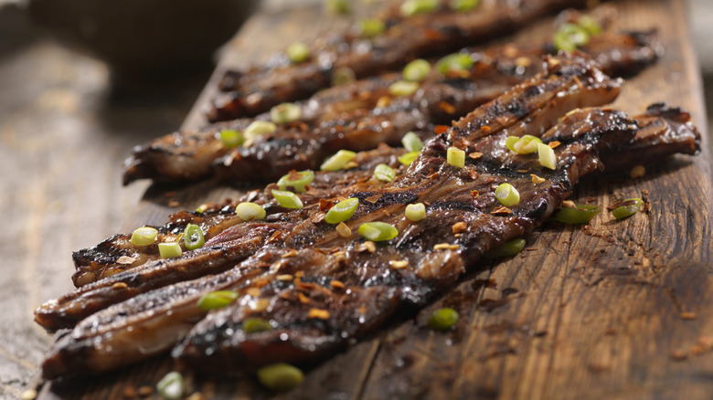korean bbq galbi on wooden cutting board