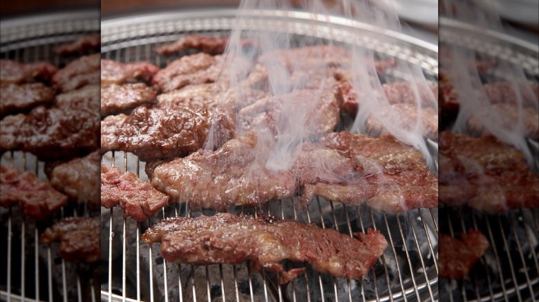 korean short ribs cooking on grill