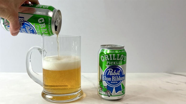 Pabst blue ribbon Grillo's pickle beer being poured into a mug