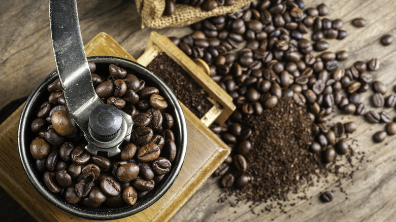 Coffee beans in a coffee grinder