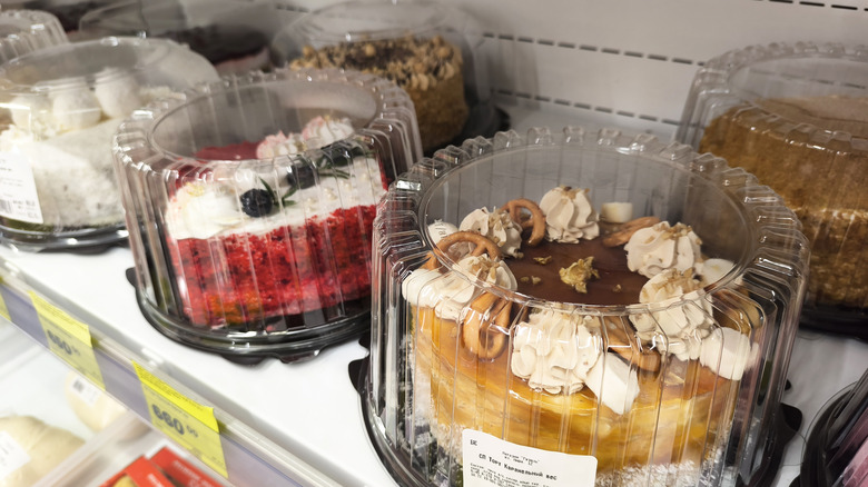 cakes with whipped cream in grocery store