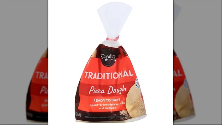 Red and black bag of Signature Select Traditional Pizza Dough from Albertsons