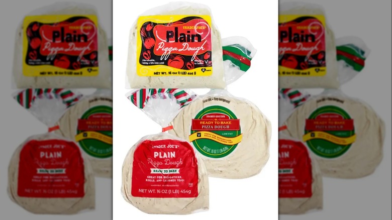 Three plastic bags of Trader Joe's Plain Pizza Dough with various label designs