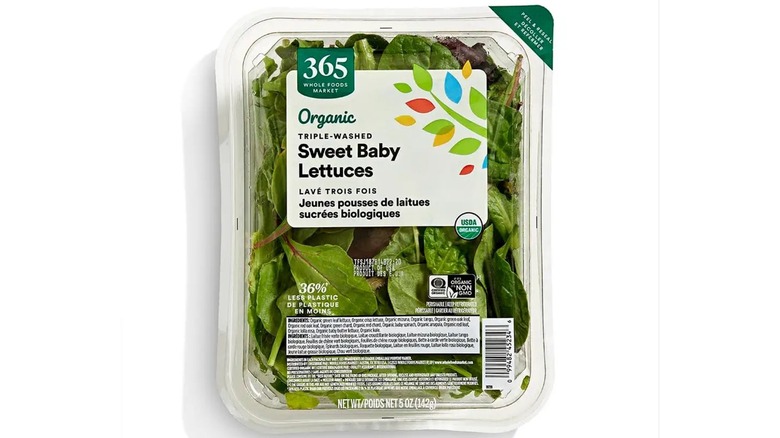 365 Whole Foods Market Sweet Baby Lettuces packaged in a plastic container.