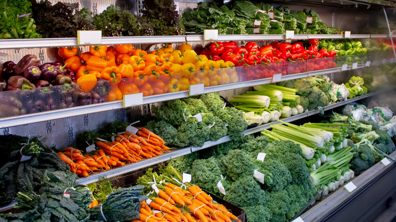 Produce section at grocery store with assortment of veg