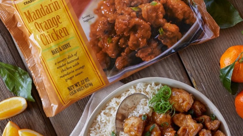 A package of Trader Joe's Mandarin Orange Chicken, along with a bowl of the product with rice