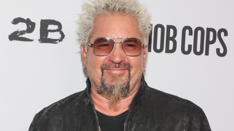 Guy Fieri smiling with sunglasses