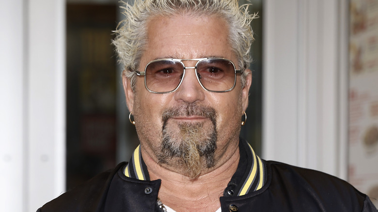 Close up of Guy Fieri wearing sunglasses