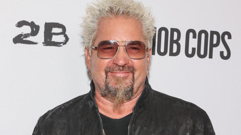 Guy Fieri smiles with sunglasses